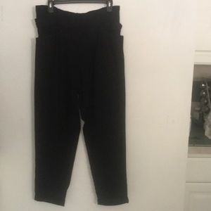 Black fabric pants with belt and two pockets